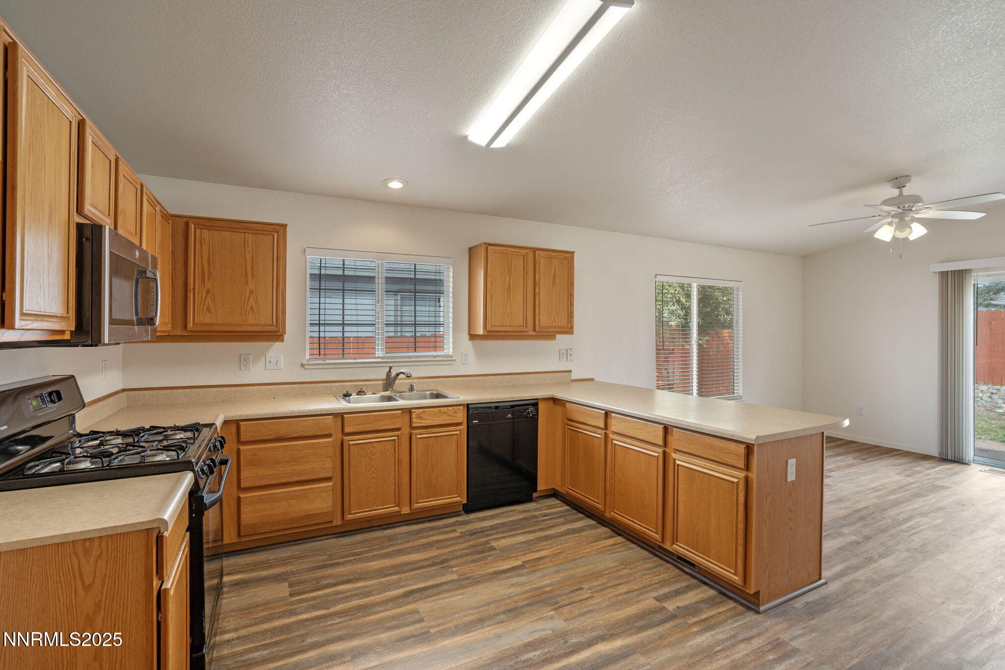 18197 Almondleaf Court Reno, NV 89508 - Photo 15 of 34 a large kitchen with stainless steel appliances granite countertop a sink and a stove