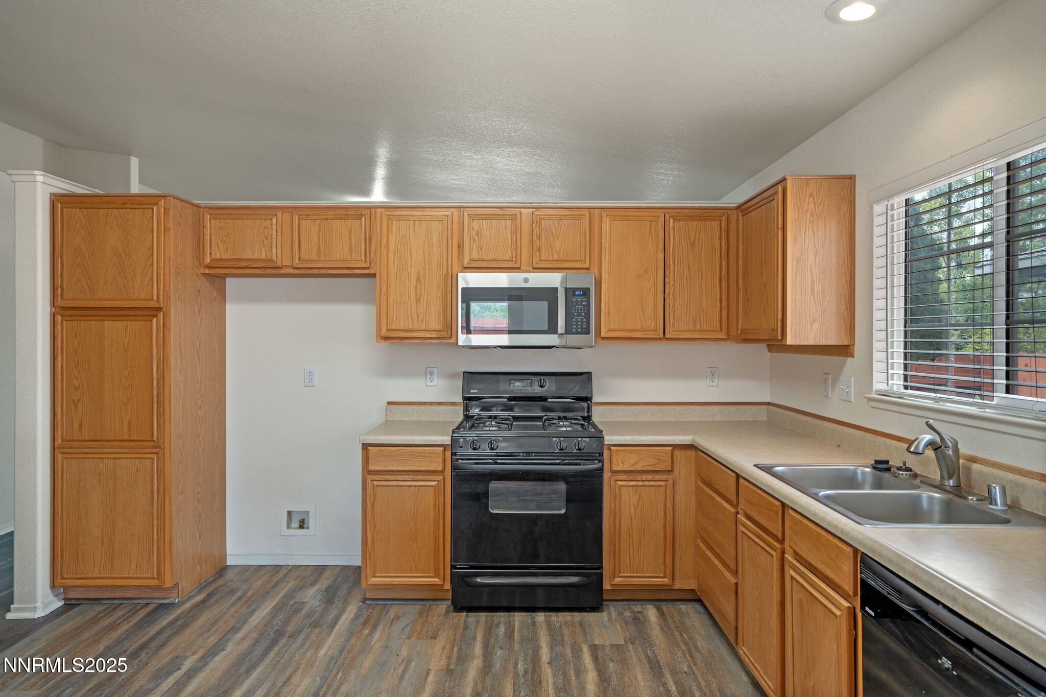 18197 Almondleaf Court Reno, NV 89508 - Photo 17 of 34 a kitchen with a sink stove and refrigerator