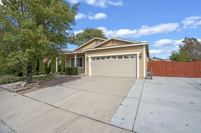a front view of a house with a garage