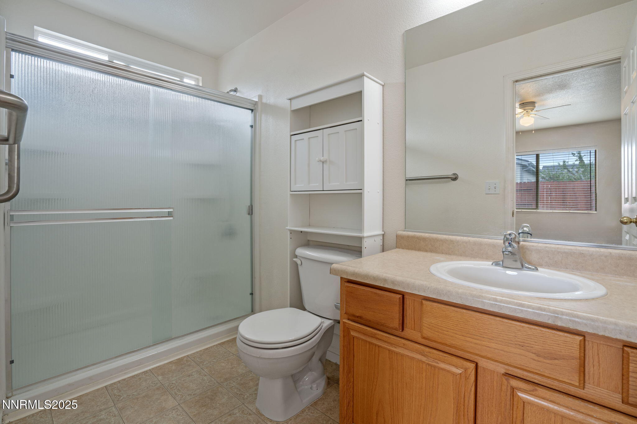 18197 Almondleaf Court Reno, NV 89508 - Photo 24 of 34 a bathroom with a granite countertop sink toilet and shower