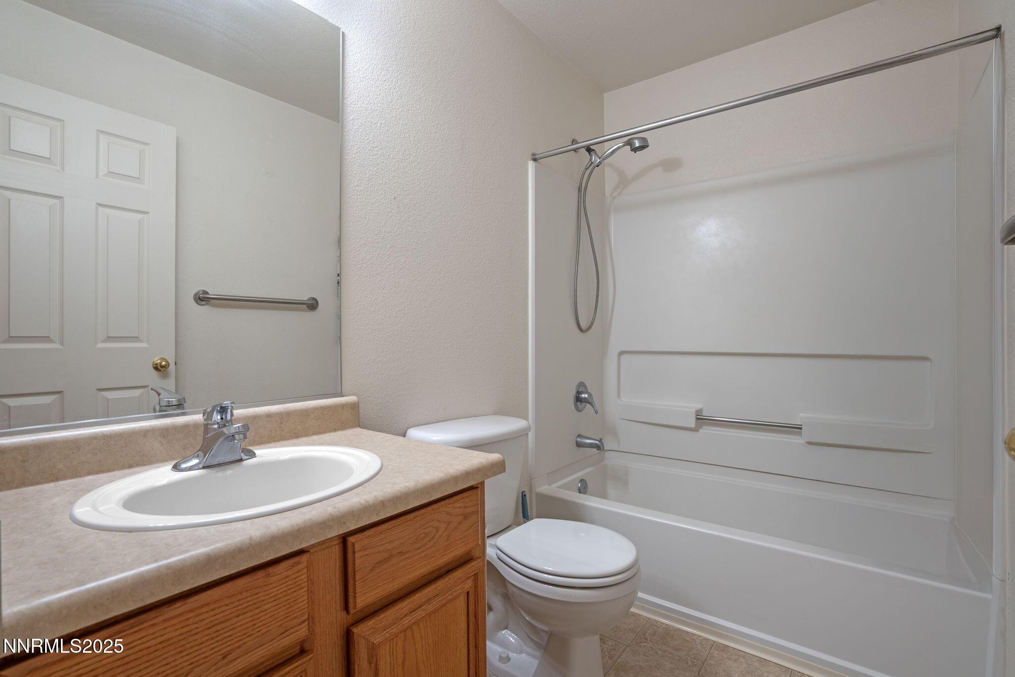 18197 Almondleaf Court Reno, NV 89508 - Photo 27 of 34 a bathroom with a sink toilet and shower