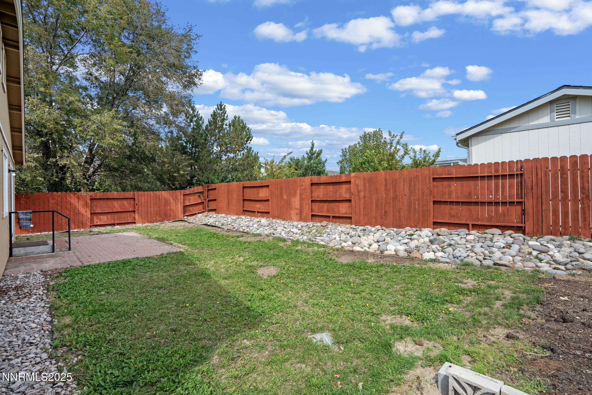 18197 Almondleaf Court Reno, NV 89508 - Photo 34 of 34 a backyard of a house with table and chairs