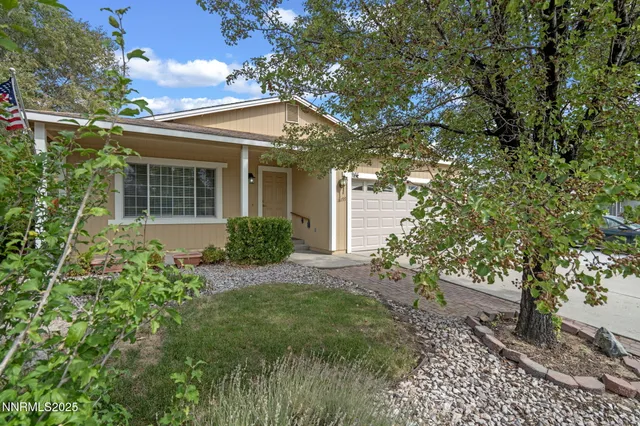 a view of a house with a tree