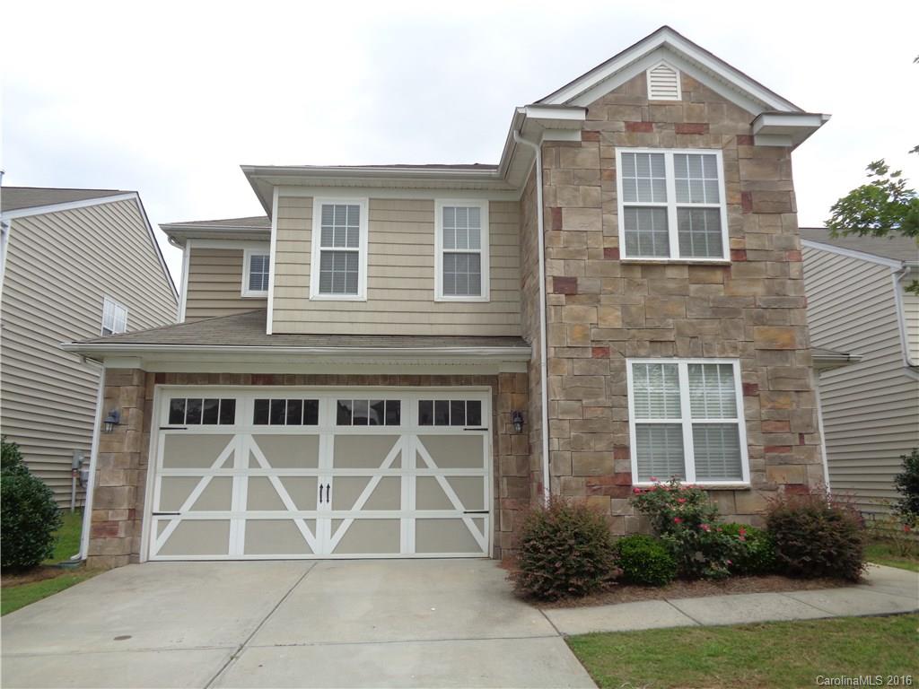 6517 Del Rio Road Charlotte, NC 28277 - Photo 2 of 15 a front view of a house with garden