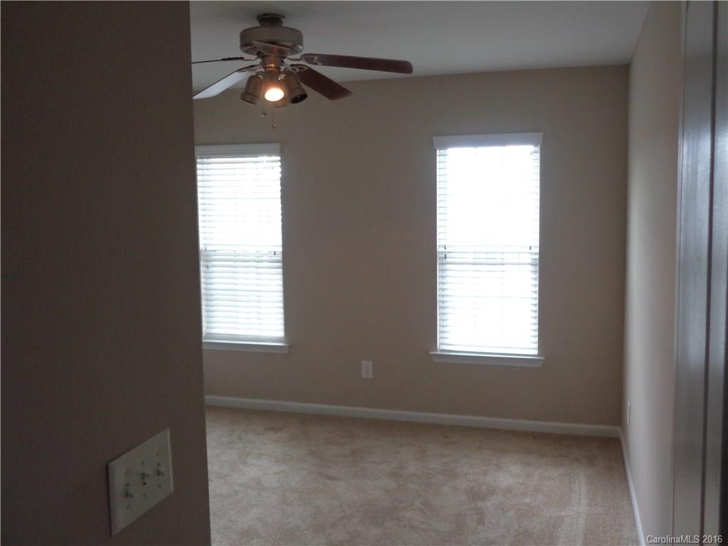 6517 Del Rio Road Charlotte, NC 28277 - Photo 11 of 15 an empty room with a window and a fan