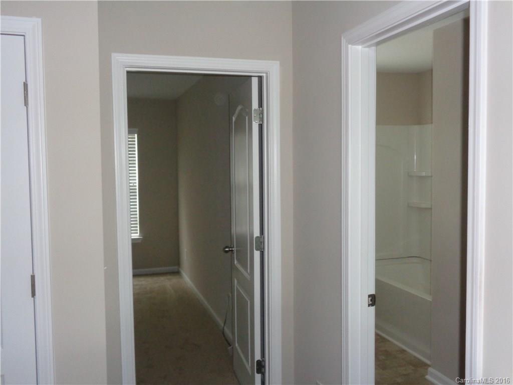 6517 Del Rio Road Charlotte, NC 28277 - Photo 12 of 15 a view of a bathroom from a hallway