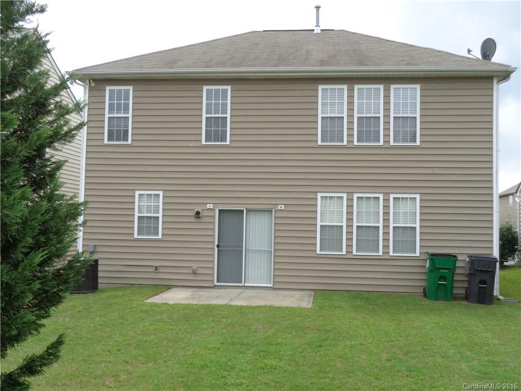 6517 Del Rio Road Charlotte, NC 28277 - Photo 14 of 15 a front view of a house with a garden