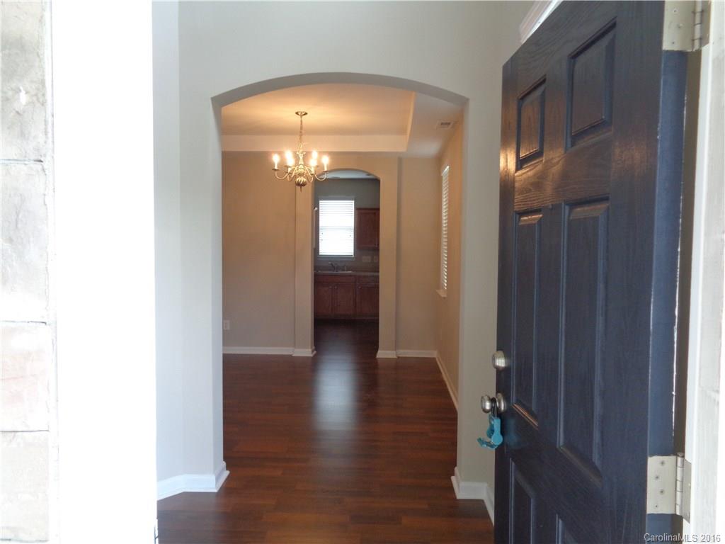 6517 Del Rio Road Charlotte, NC 28277 - Photo 3 of 15 a view of a hallway with wooden floor
