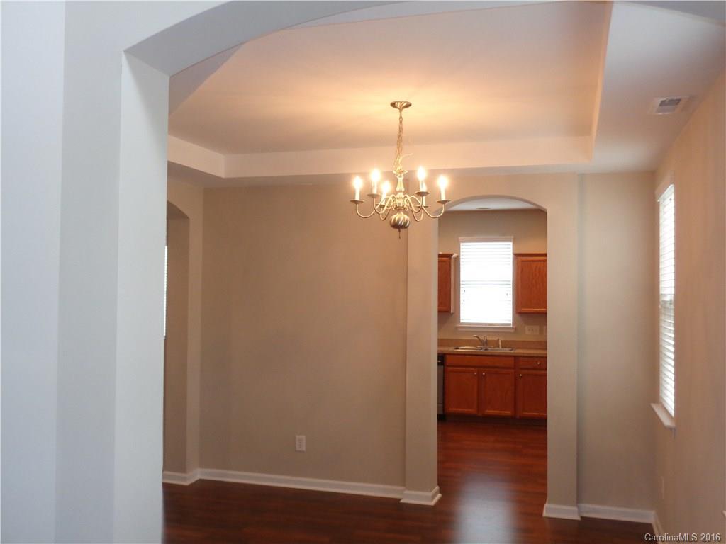 6517 Del Rio Road Charlotte, NC 28277 - Photo 4 of 15 a view of a room with a windows and wooden floor