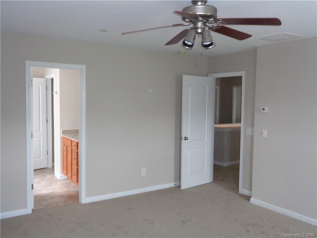 6517 Del Rio Road Charlotte, NC 28277 - Photo 10 of 15 a view of a chandelier fan in a room