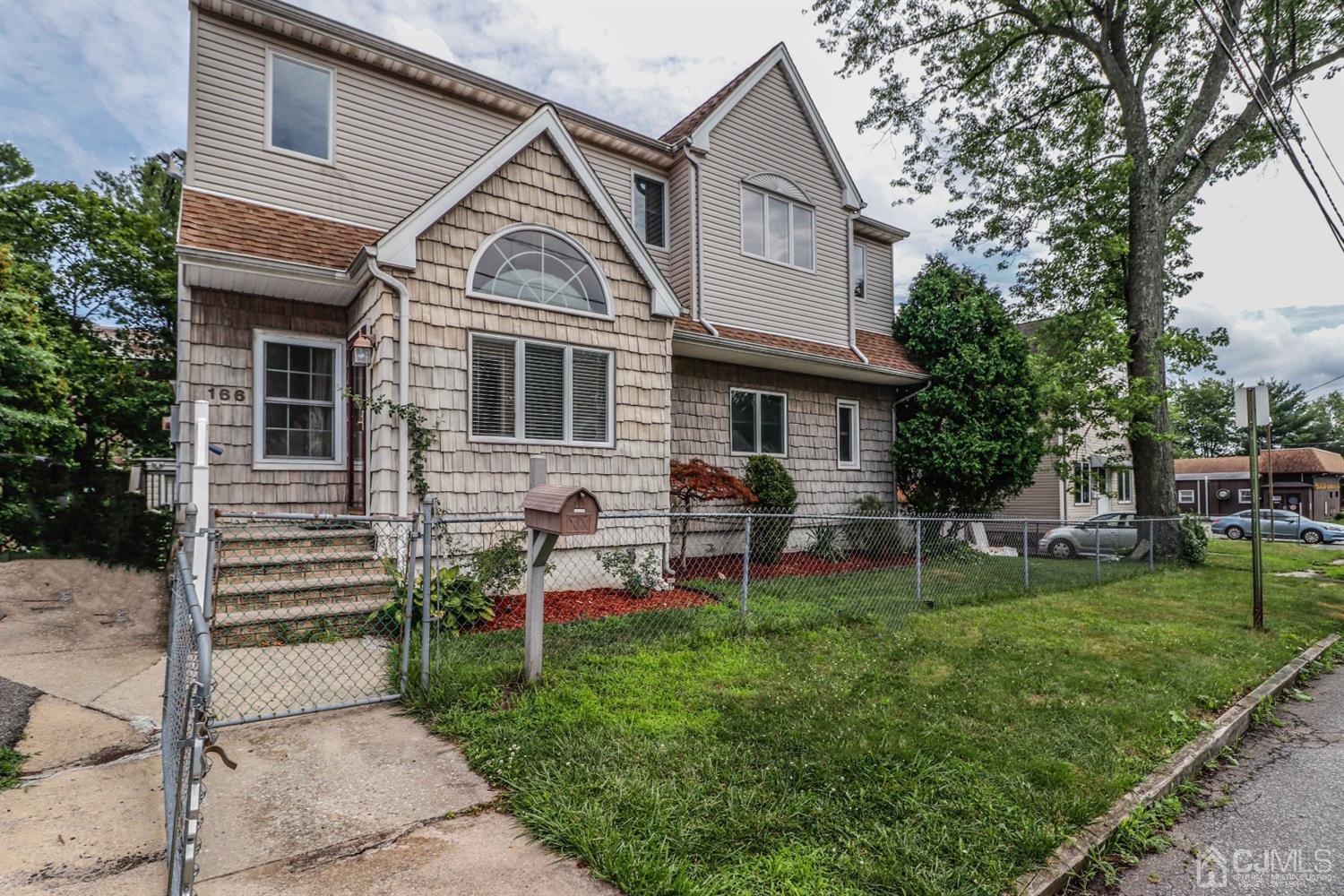 166 Brower Avenue Edison, NJ 08837 - Photo 2 of 48 a front view of house with a garden and patio