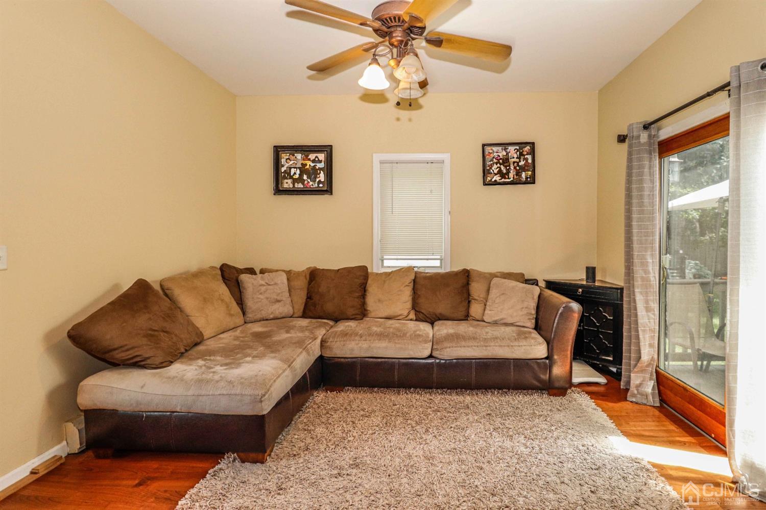166 Brower Avenue Edison, NJ 08837 - Photo 14 of 48 a living room with furniture and a glass door