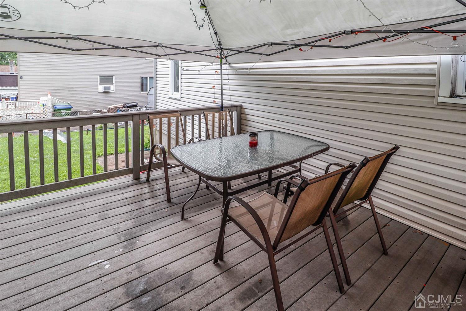 166 Brower Avenue Edison, NJ 08837 - Photo 16 of 48 a view of a chairs and table on the deck
