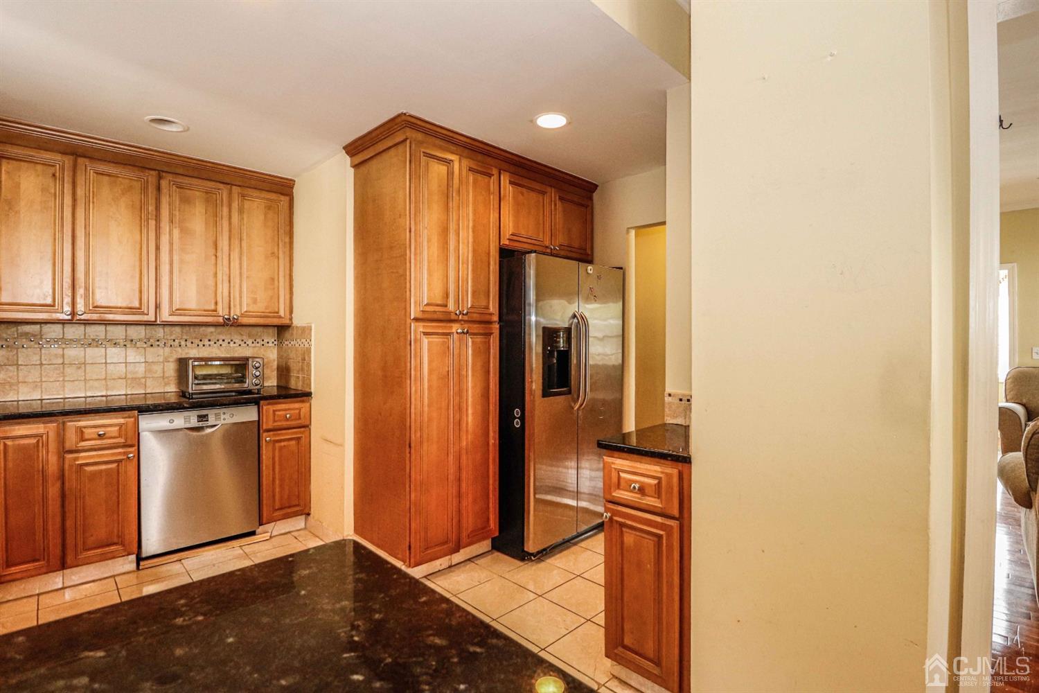 166 Brower Avenue Edison, NJ 08837 - Photo 20 of 48 a kitchen with stainless steel appliances granite countertop a refrigerator and a stove top oven