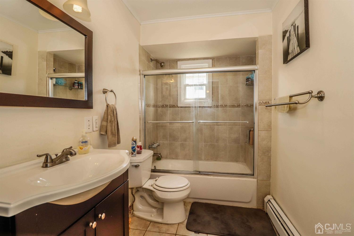 166 Brower Avenue Edison, NJ 08837 - Photo 26 of 48 a bathroom with a sink a toilet and shower