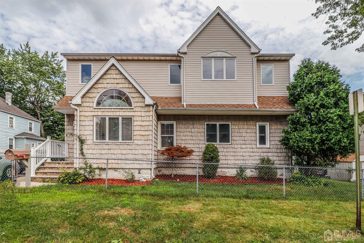 166 Brower Avenue Edison, NJ 08837 - Photo 4 of 48 a front view of a house with a yard
