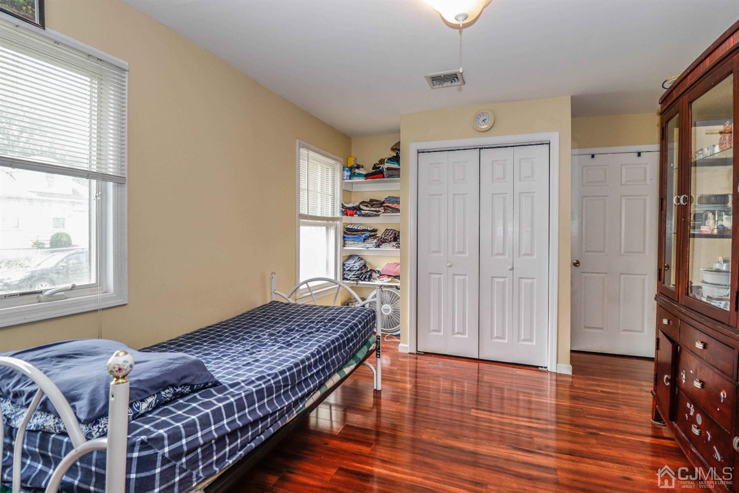 166 Brower Avenue Edison, NJ 08837 - Photo 36 of 48 a bedroom with a bed and a window