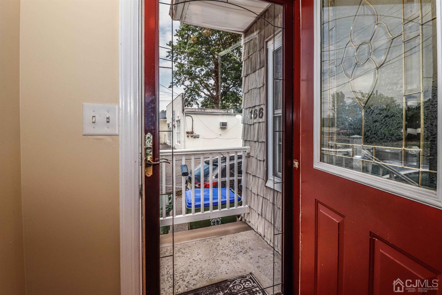 166 Brower Avenue Edison, NJ 08837 - Photo 5 of 48 a view of a balcony with a small yard