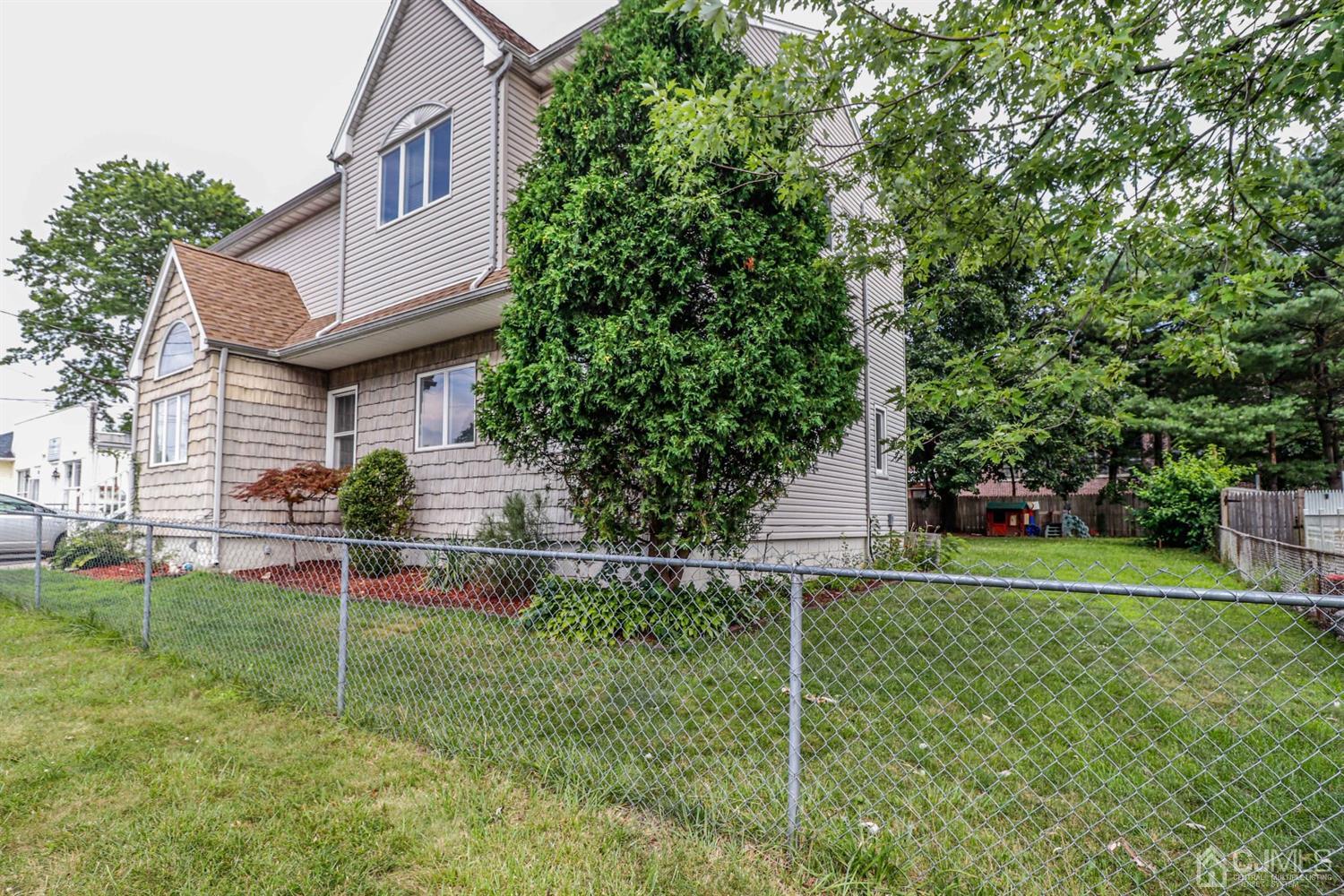 166 Brower Avenue Edison, NJ 08837 - Photo 44 of 48 a house view with a garden space