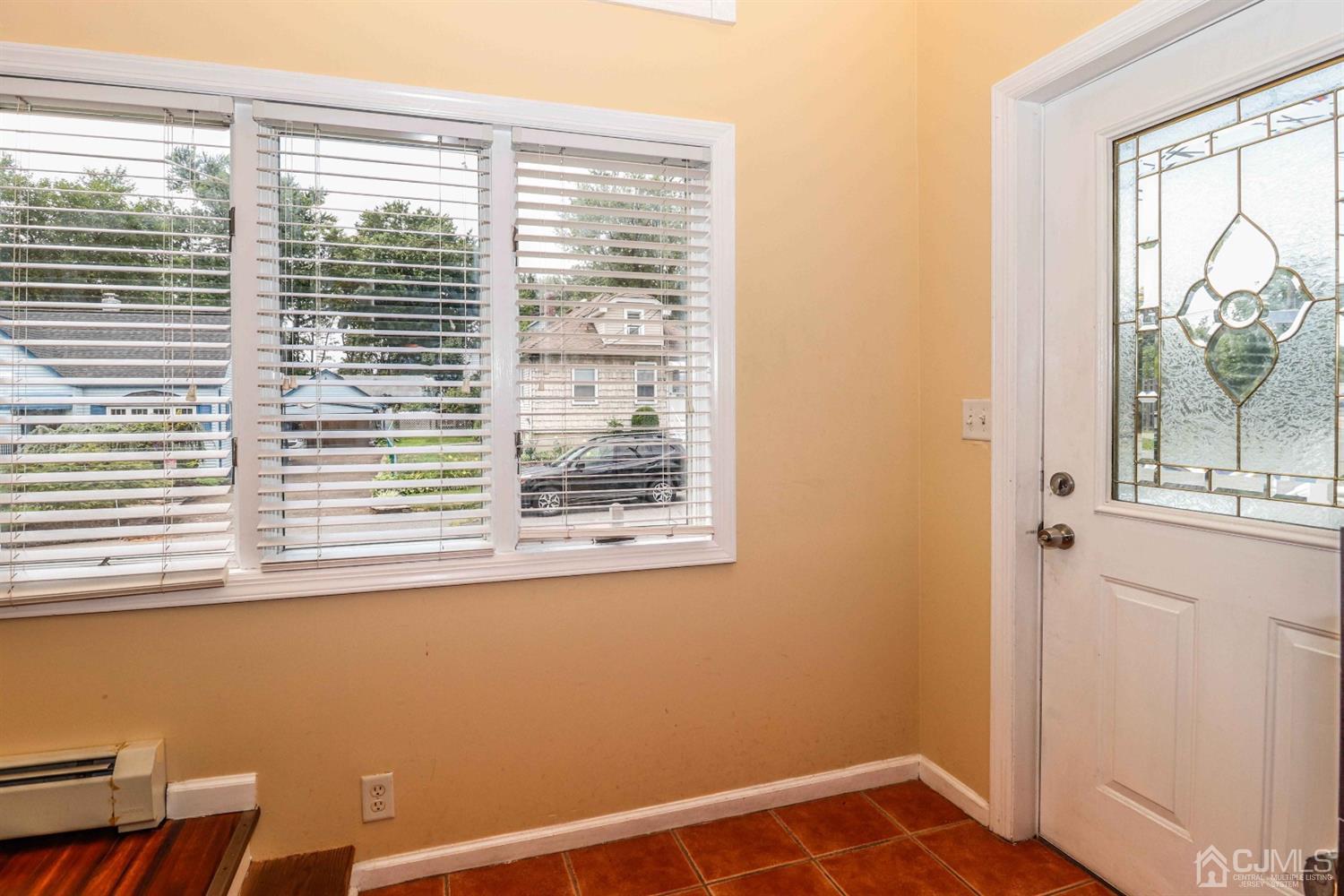 166 Brower Avenue Edison, NJ 08837 - Photo 7 of 48 a view of a room that has a window in it