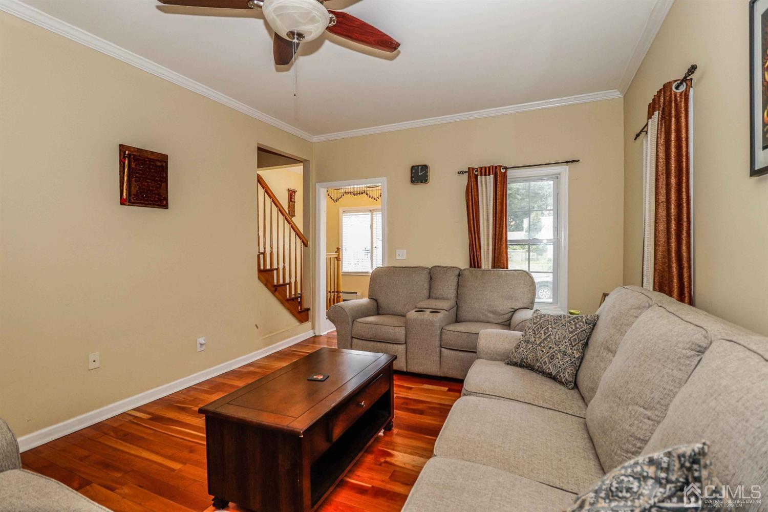 166 Brower Avenue Edison, NJ 08837 - Photo 8 of 48 a living room with furniture and a flat screen tv