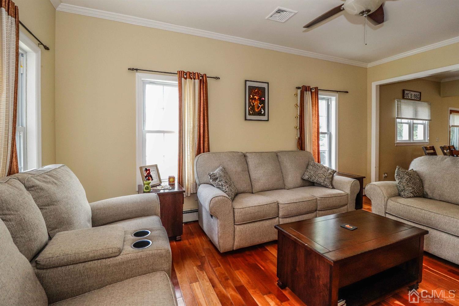 166 Brower Avenue Edison, NJ 08837 - Photo 9 of 48 a living room with furniture and a window