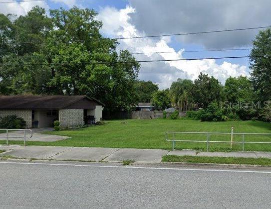 1005 North Park Road Plant City, FL 33563 - Photo 1 of 1 a view of a house and a yard and a garage