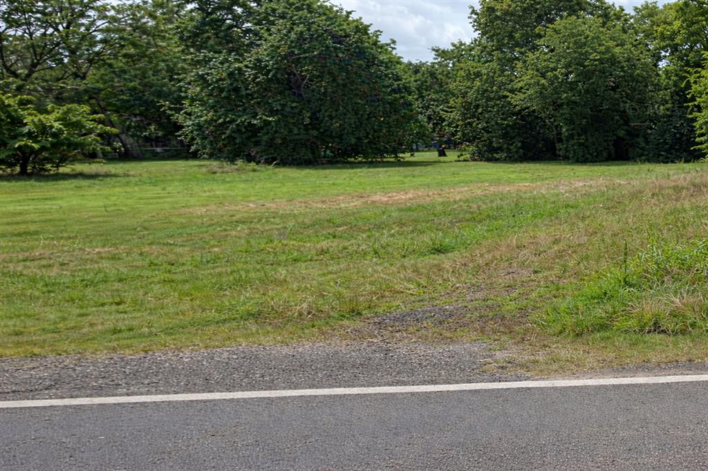 102 Frisco Street Cumby, TX 75433 - Photo 2 of 4 a view of a field with a trees