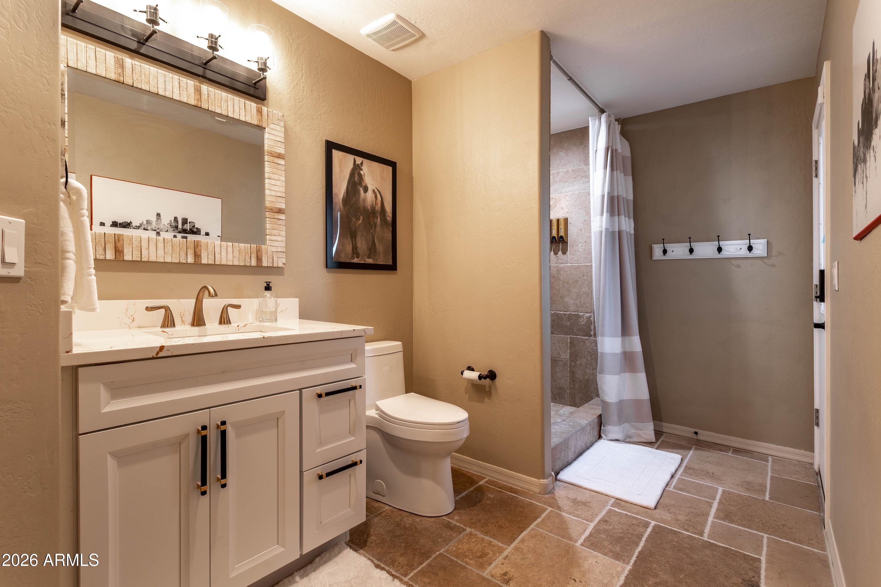 4727 East Rancho Caliente Drive Cave Creek, AZ 85331 - Photo 34 of 76 downstairs hall bath 01