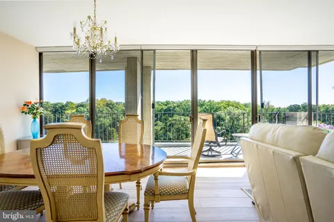 a view of a living room with furniture and a window