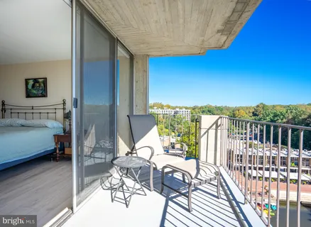 a view of balcony with furniture