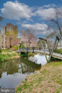 a view of a balcony with wooden floor and city view