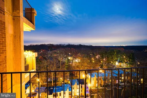 a view of a swimming pool with outdoor seating