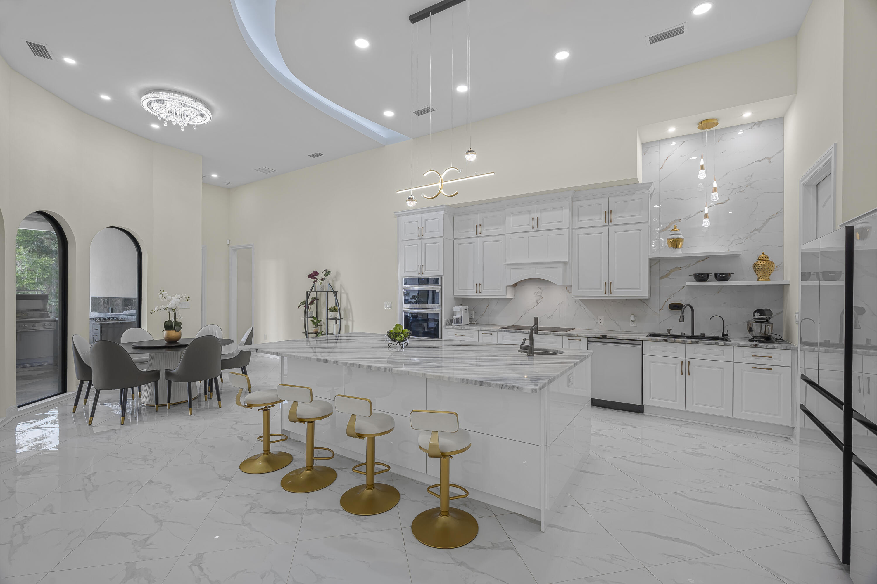 8073 Thoroughbred Road Pensacola, FL 32526 - Photo 5 of 65 a large kitchen with stainless steel appliances lots of counter space and breakfast area