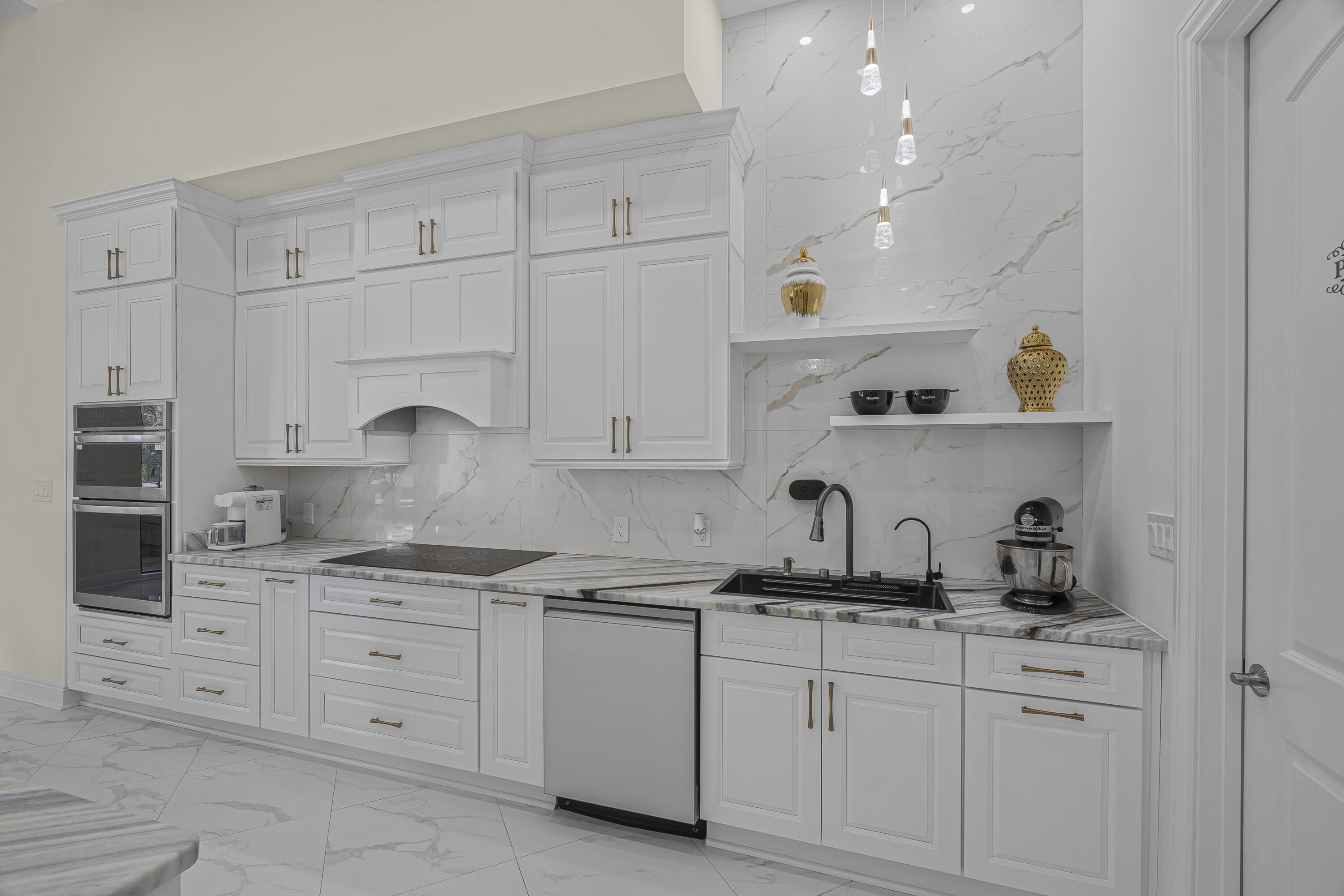 8073 Thoroughbred Road Pensacola, FL 32526 - Photo 6 of 65 a kitchen with white cabinets stainless steel appliances and sink