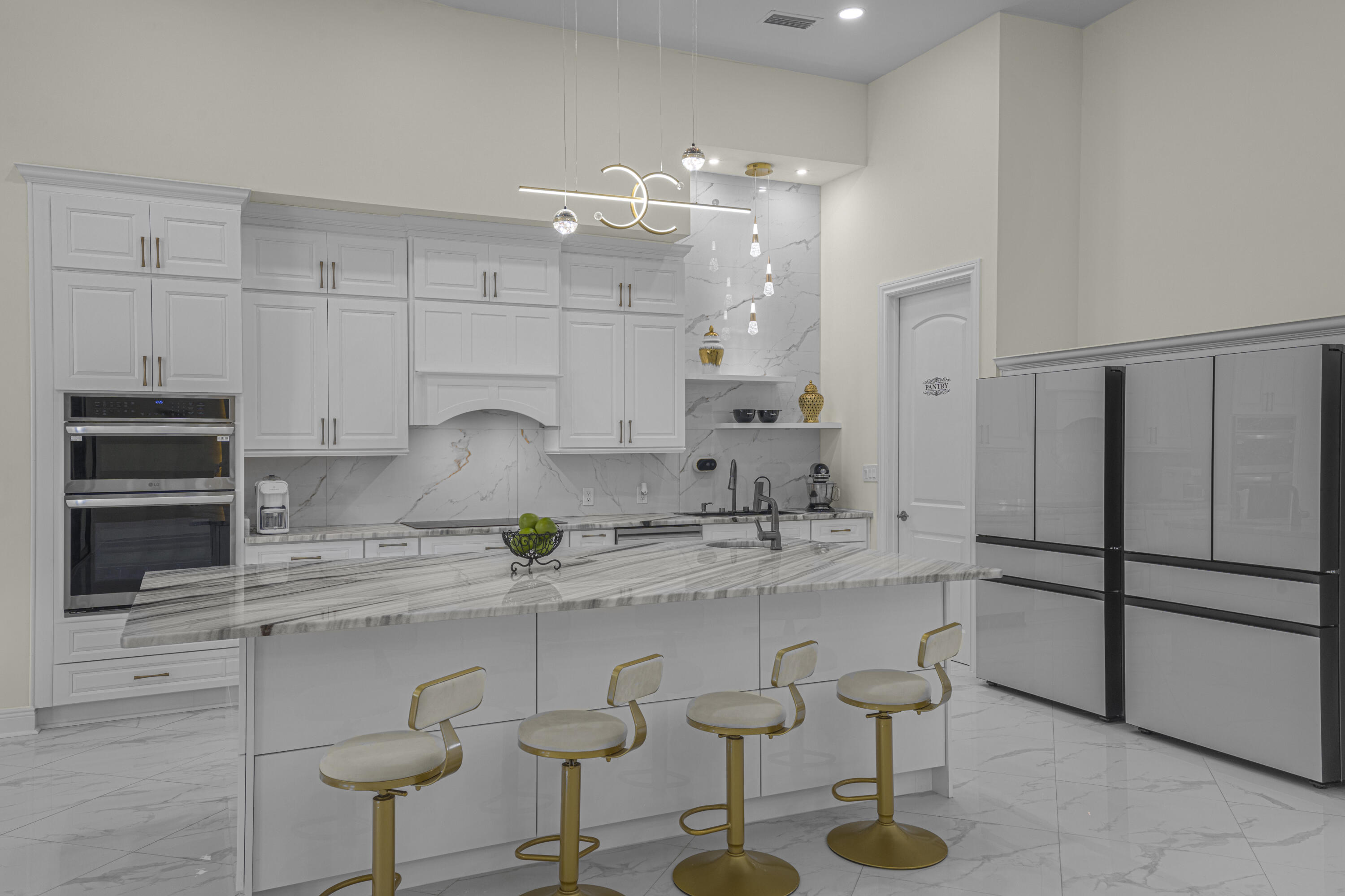 8073 Thoroughbred Road Pensacola, FL 32526 - Photo 10 of 65 a kitchen with stainless steel appliances kitchen island granite countertop a sink and cabinets