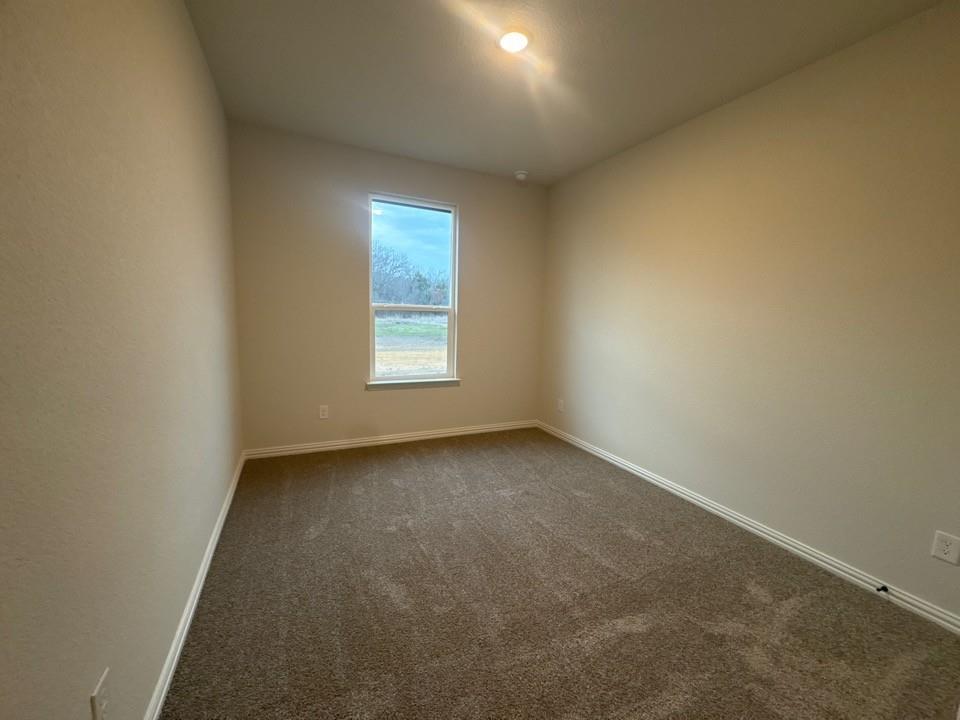 9013 County Road 623 Blue Ridge, TX 75424 - Photo 11 of 15 an empty room with a window