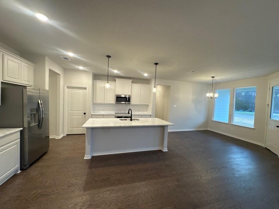 9013 County Road 623 Blue Ridge, TX 75424 - Photo 8 of 15 a view of kitchen with kitchen island stainless steel appliances sink refrigerator and microwave