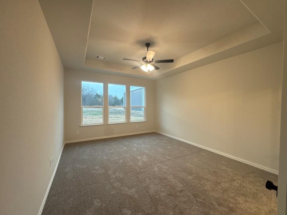 9013 County Road 623 Blue Ridge, TX 75424 - Photo 9 of 15 an empty room with windows and ceiling fan