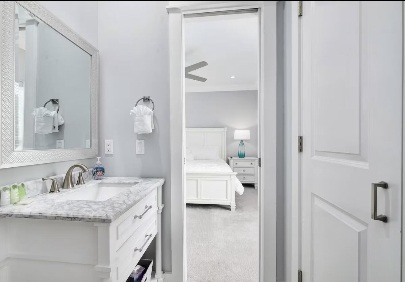 37 Grande Pointe Drive Inlet Beach, FL 32461 - Photo 30 of 58 a en suite bathroom with a granite countertop sink and a mirror