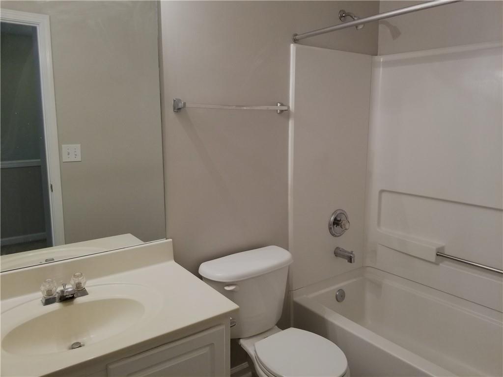 4081 Howell Park Road Duluth, GA 30096 - Photo 8 of 12 a bathroom with a sink toilet and shower