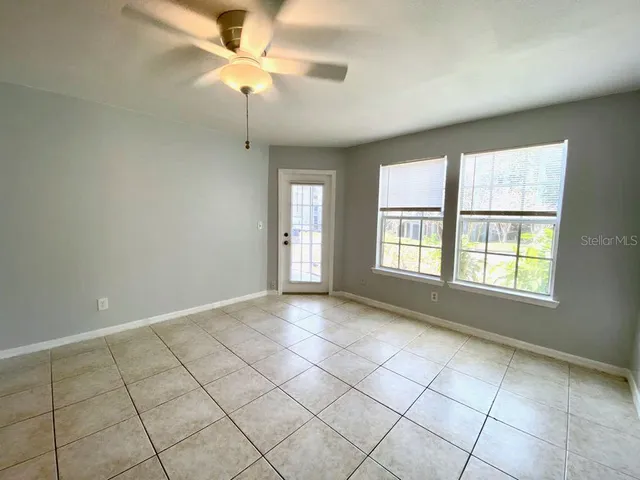 a view of an empty room with a window