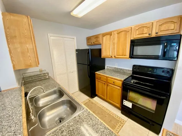 a kitchen with a stove microwave and refrigerator