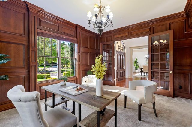 a view of a dining room with furniture window and outside view