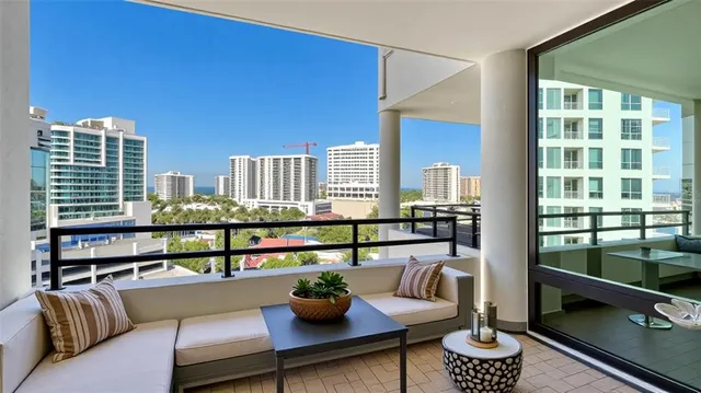 a spacious bedroom with a large bed and a chandelier