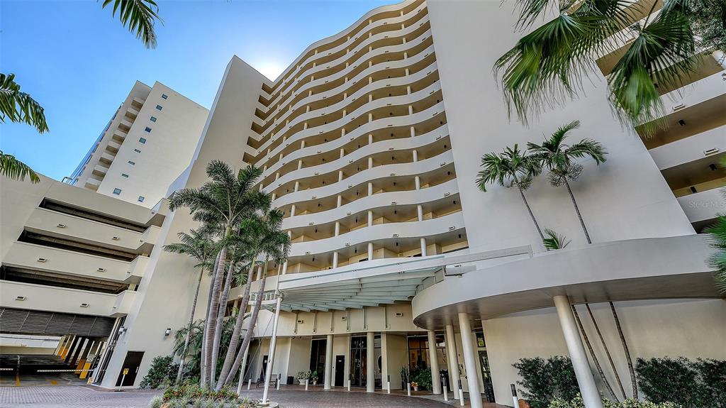 1255 North Gulfstream Avenue, Unit 1101 Sarasota, FL 34236 - Photo 3 of 75 a view of a building with a palm tree