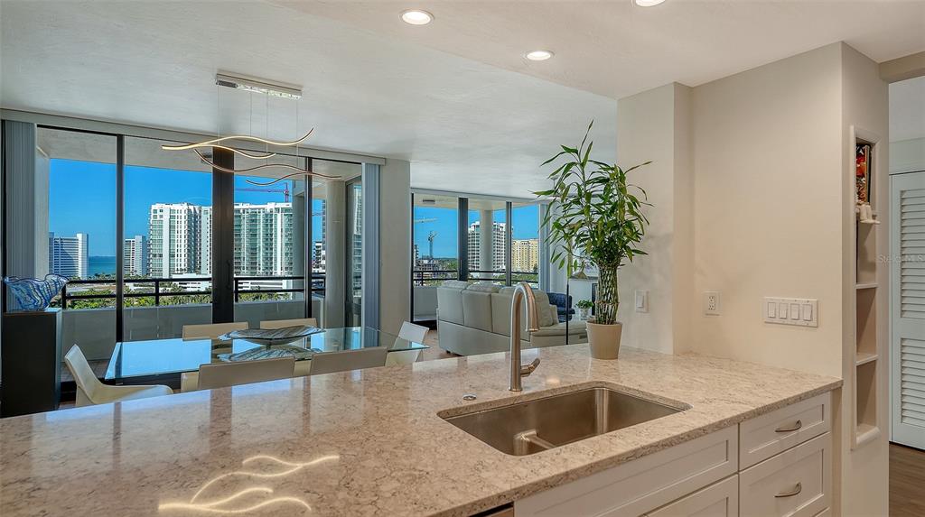 1255 North Gulfstream Avenue, Unit 1101 Sarasota, FL 34236 - Photo 31 of 75 a kitchen with a sink and breakfast area