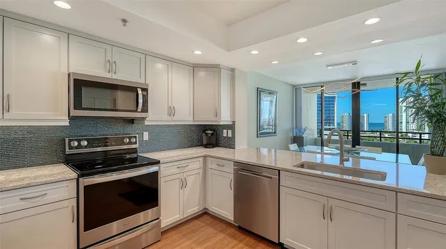 a view of a balcony with furniture and a potted plant