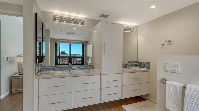 a living room with furniture and a book shelf