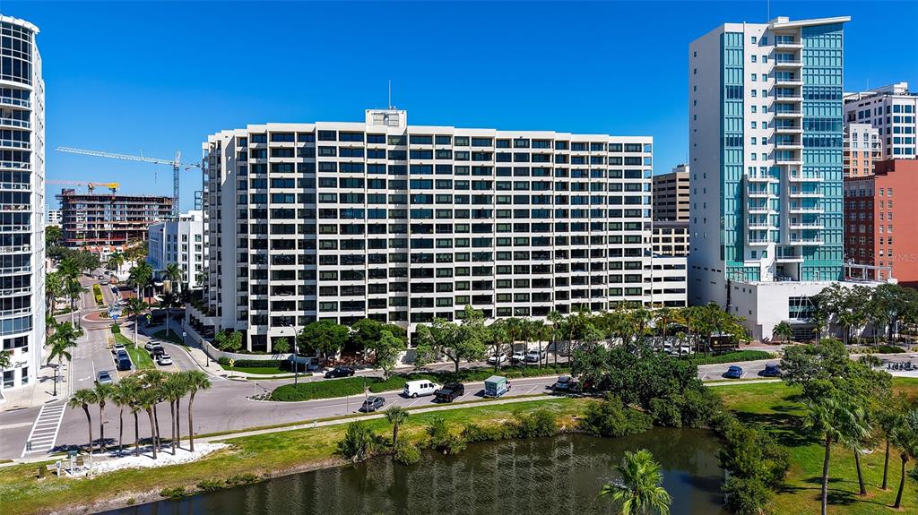 1255 North Gulfstream Avenue, Unit 1101 Sarasota, FL 34236 - Photo 57 of 75 a view of a building with a yard